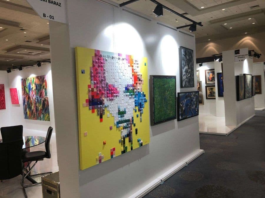 a wall with art pieces on it